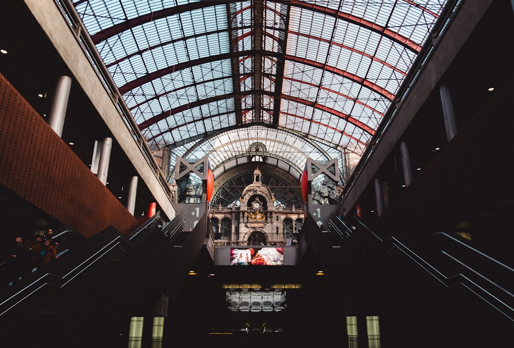 people walking on the stairs inside the building