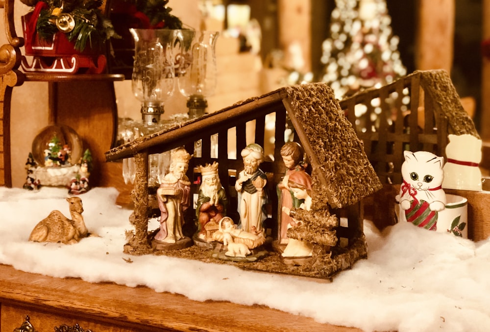 brown wooden house miniature on white table