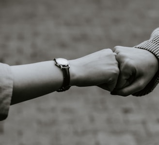 person wearing silver link bracelet watch