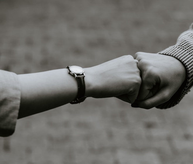 person wearing silver link bracelet watch