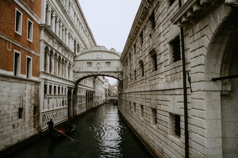 boat on river near building during daytime