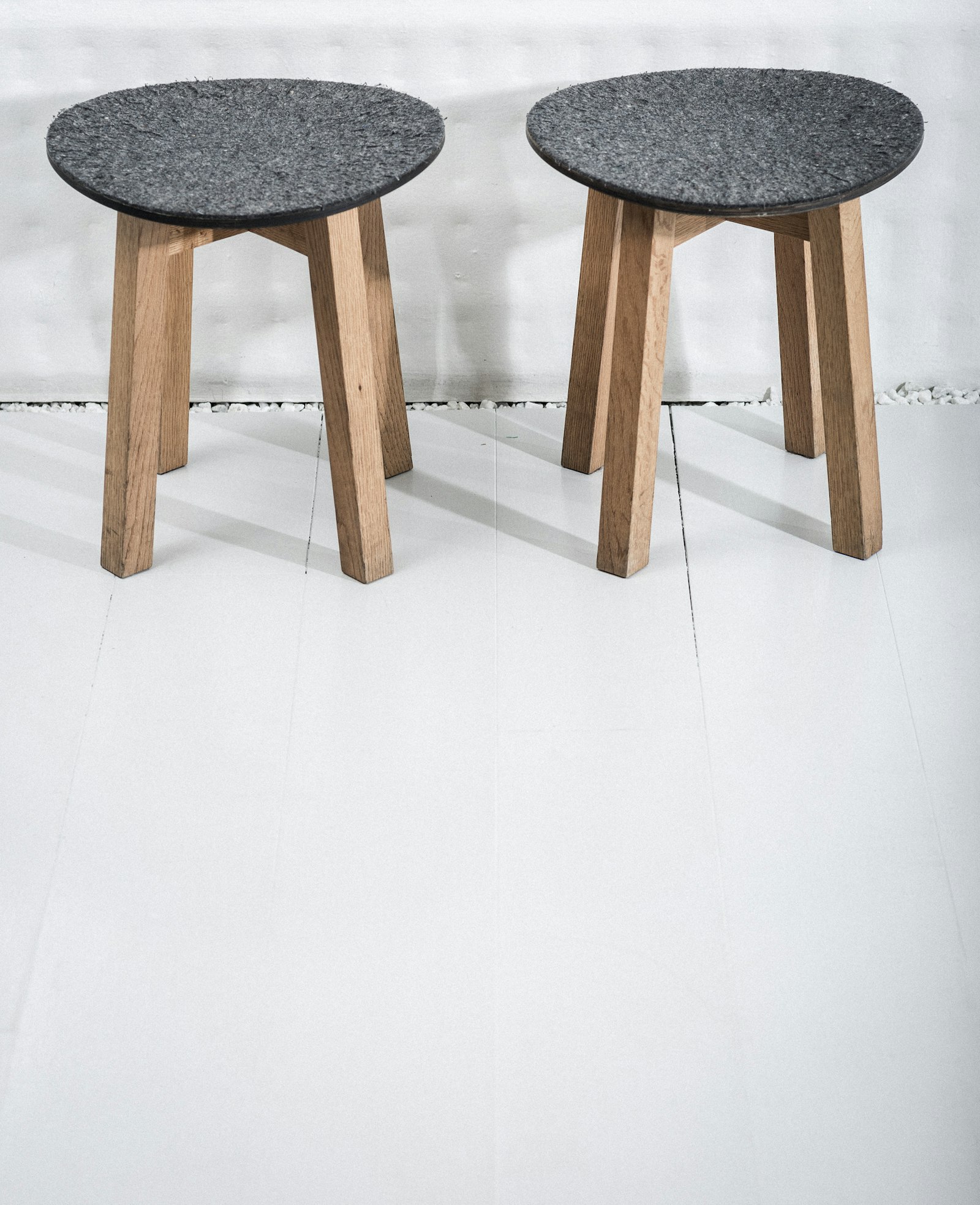 Sigma 85mm F1.4 EX DG HSM sample photo. 2 gray and brown stools photography