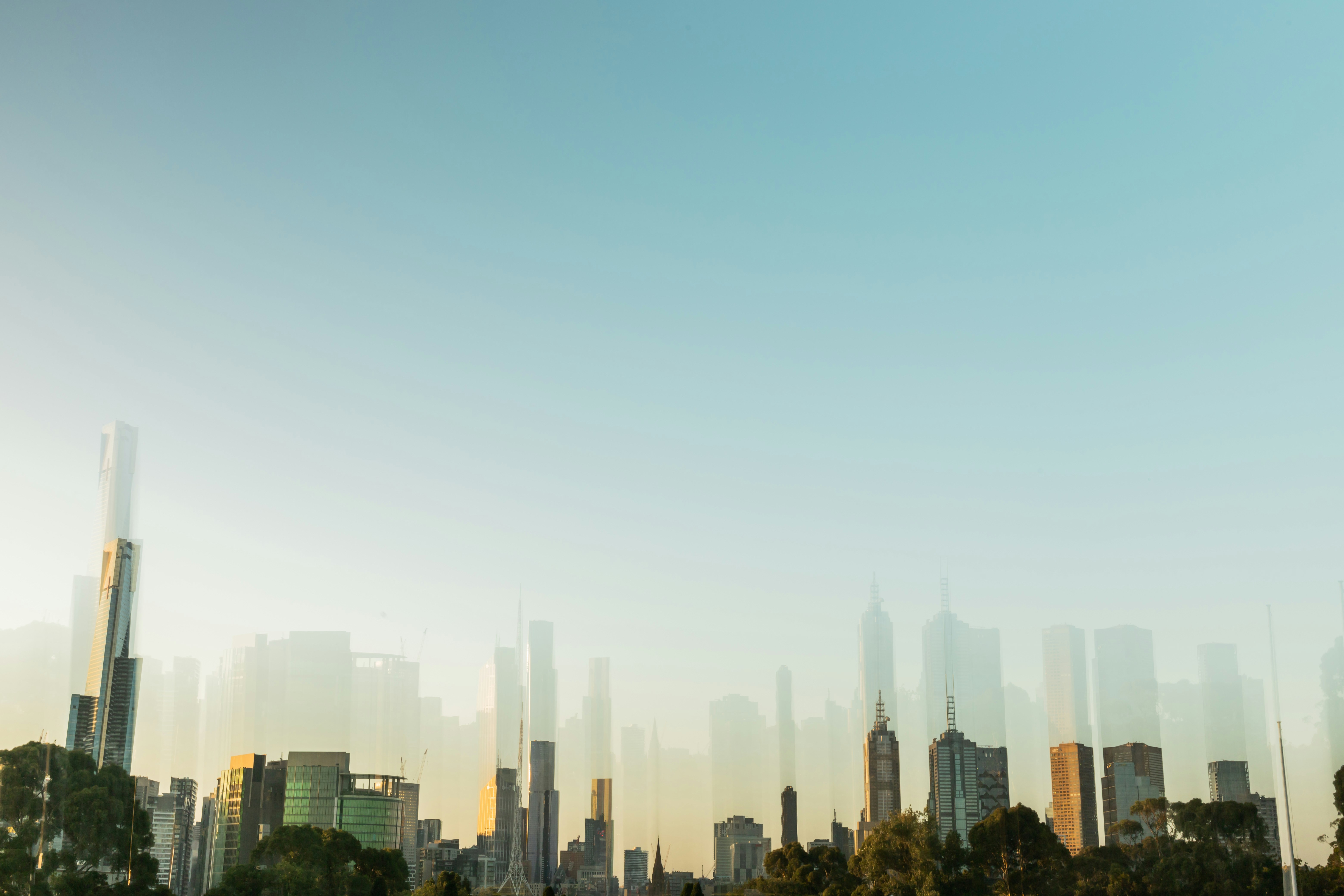 city skyline under blue sky during daytime, Double Skyline