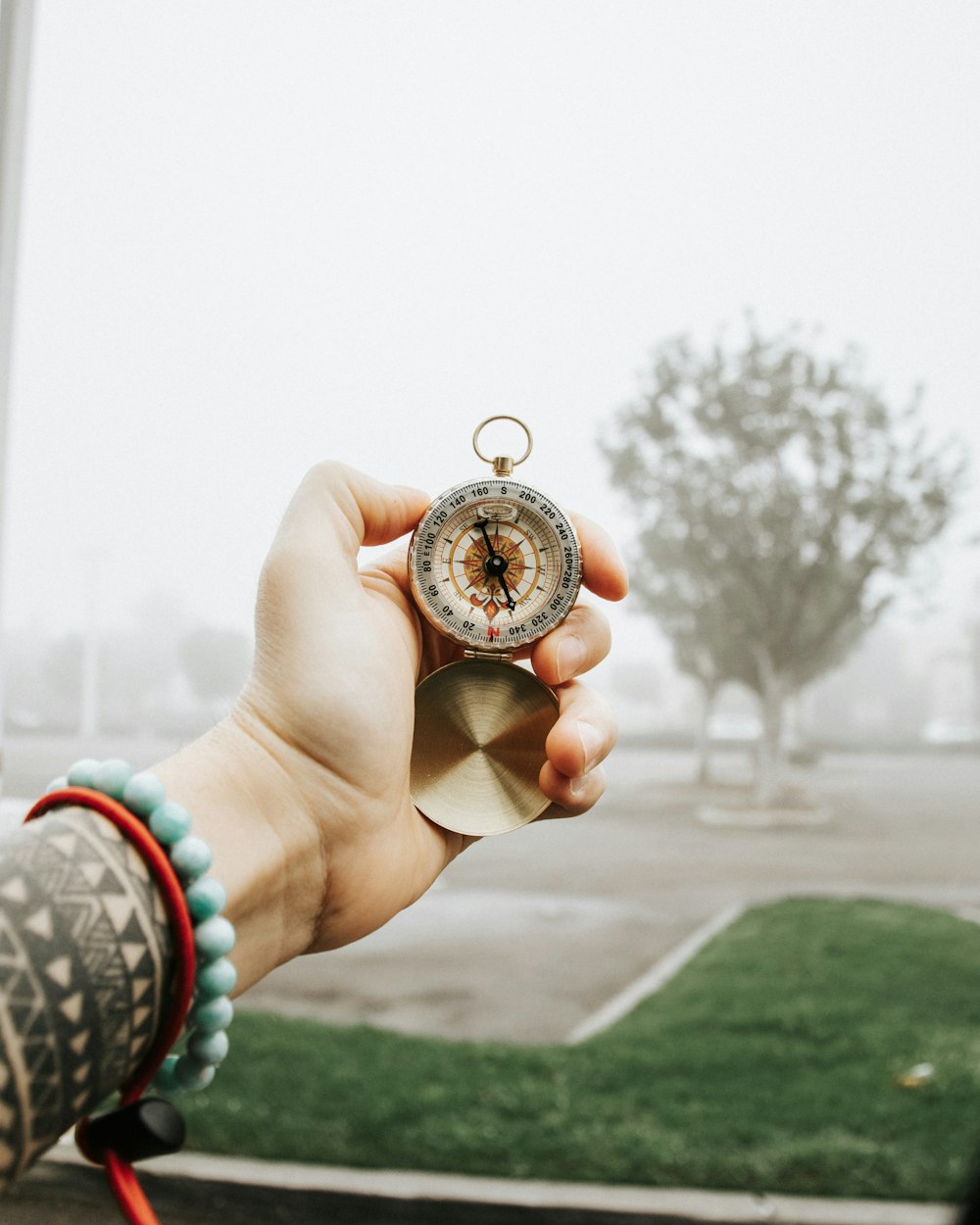 person holding silver round coin