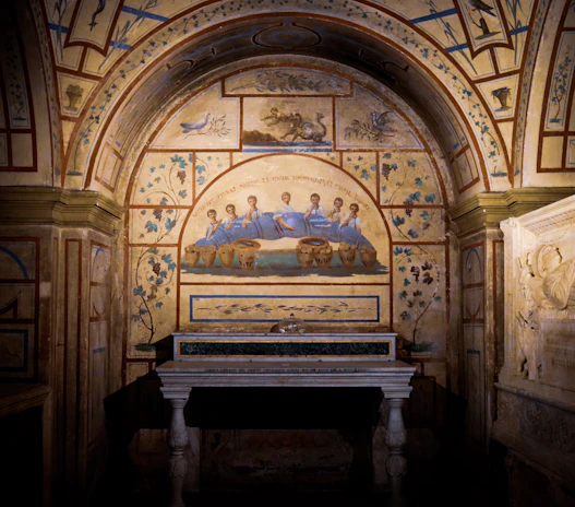 An ancient Roman feast scene featuring reclining diners, colorful frescoes, and traditional pottery on the table.