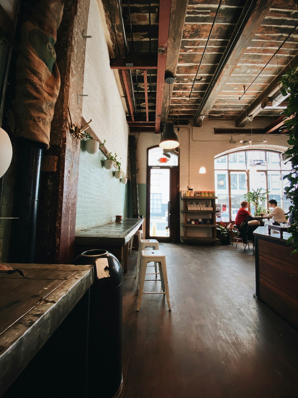 brown wooden table near window