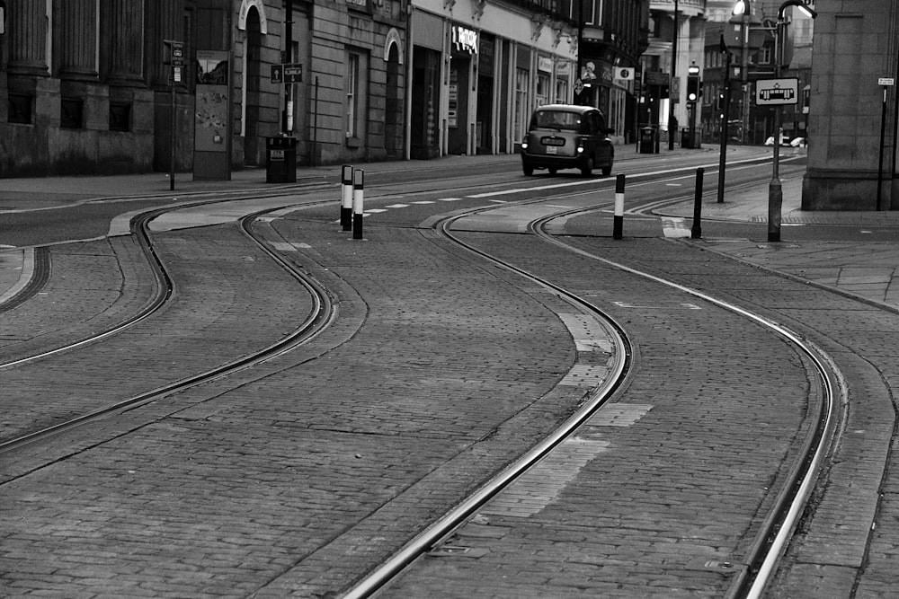 grayscale photo of cars on road