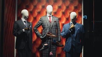 man in black suit standing near shoes