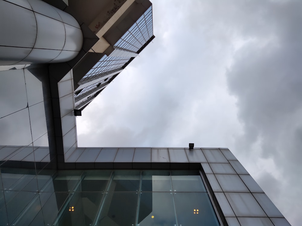 white and black concrete building under white clouds during daytime