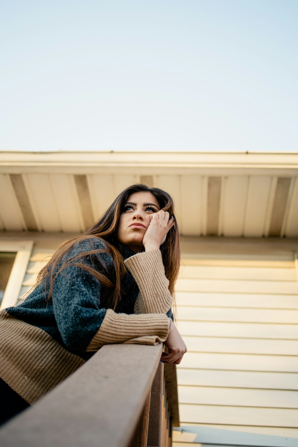 woman in blue denim jacket and brown scarf