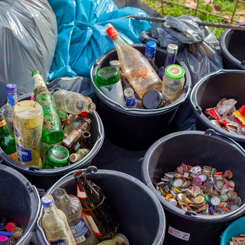 assorted plastic bottles in black plastic bucket