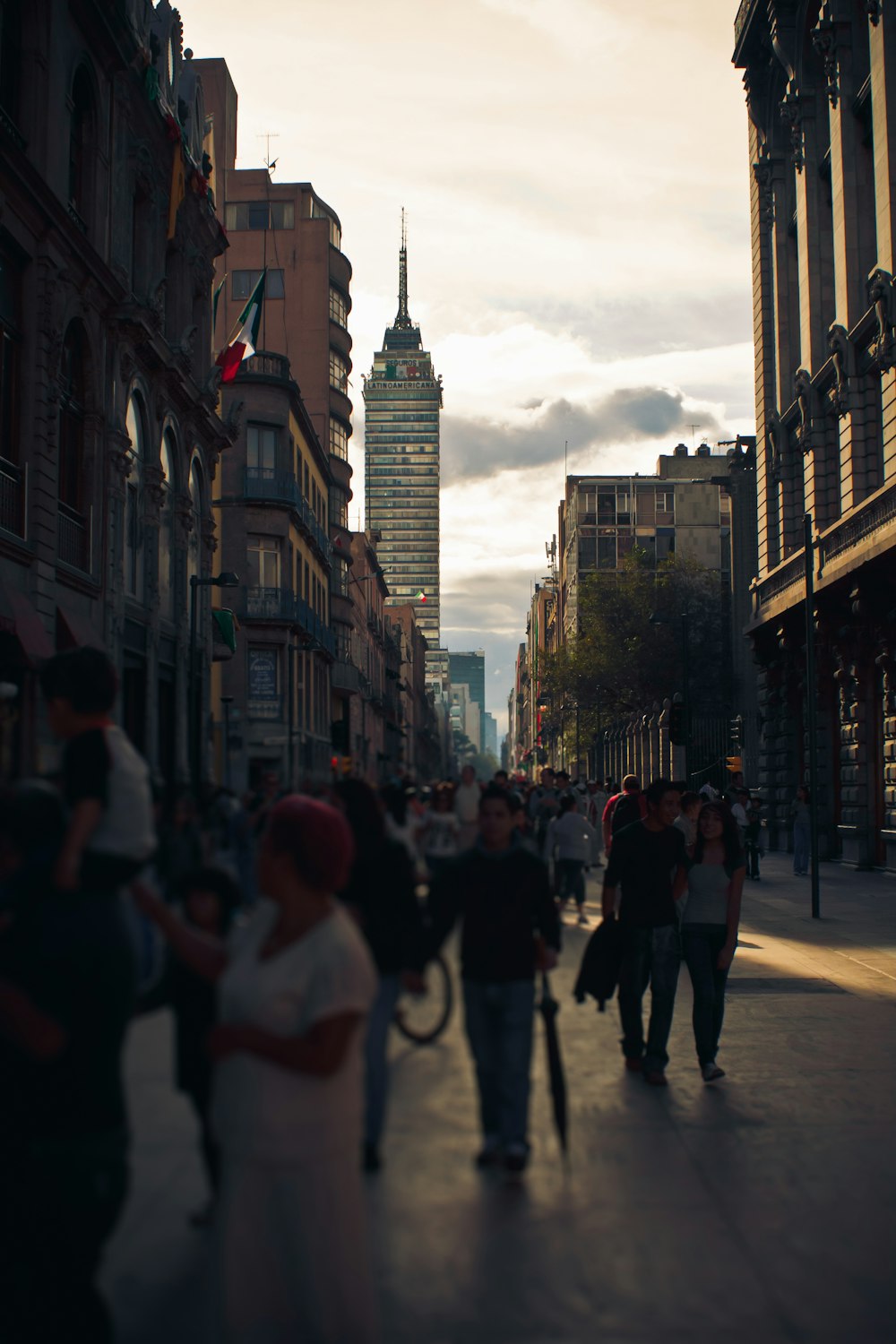 people walking on street near high rise buildings during daytime