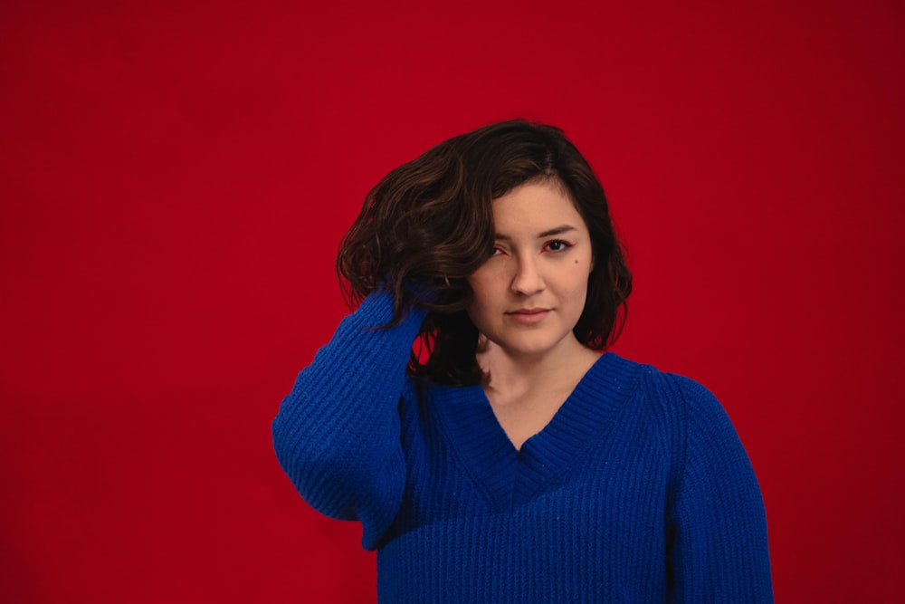 woman in blue v neck sweater