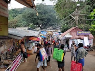 A bustling local market street near the hotel entrance.