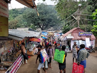 A bustling local market street near the hotel entrance.