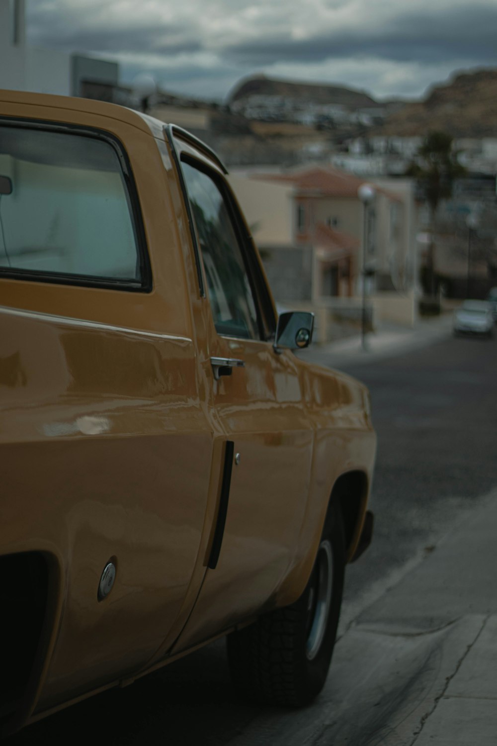 yellow car on the road during daytime