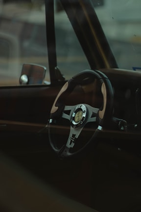 black and silver steering wheel