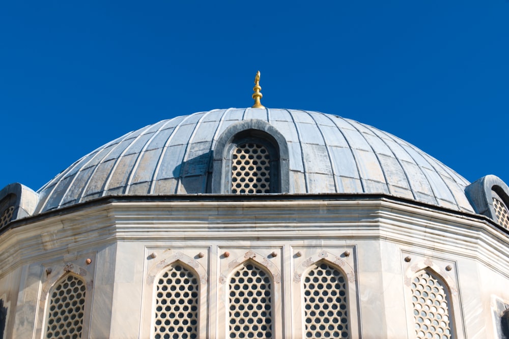 white and blue dome building under blue sky during daytime