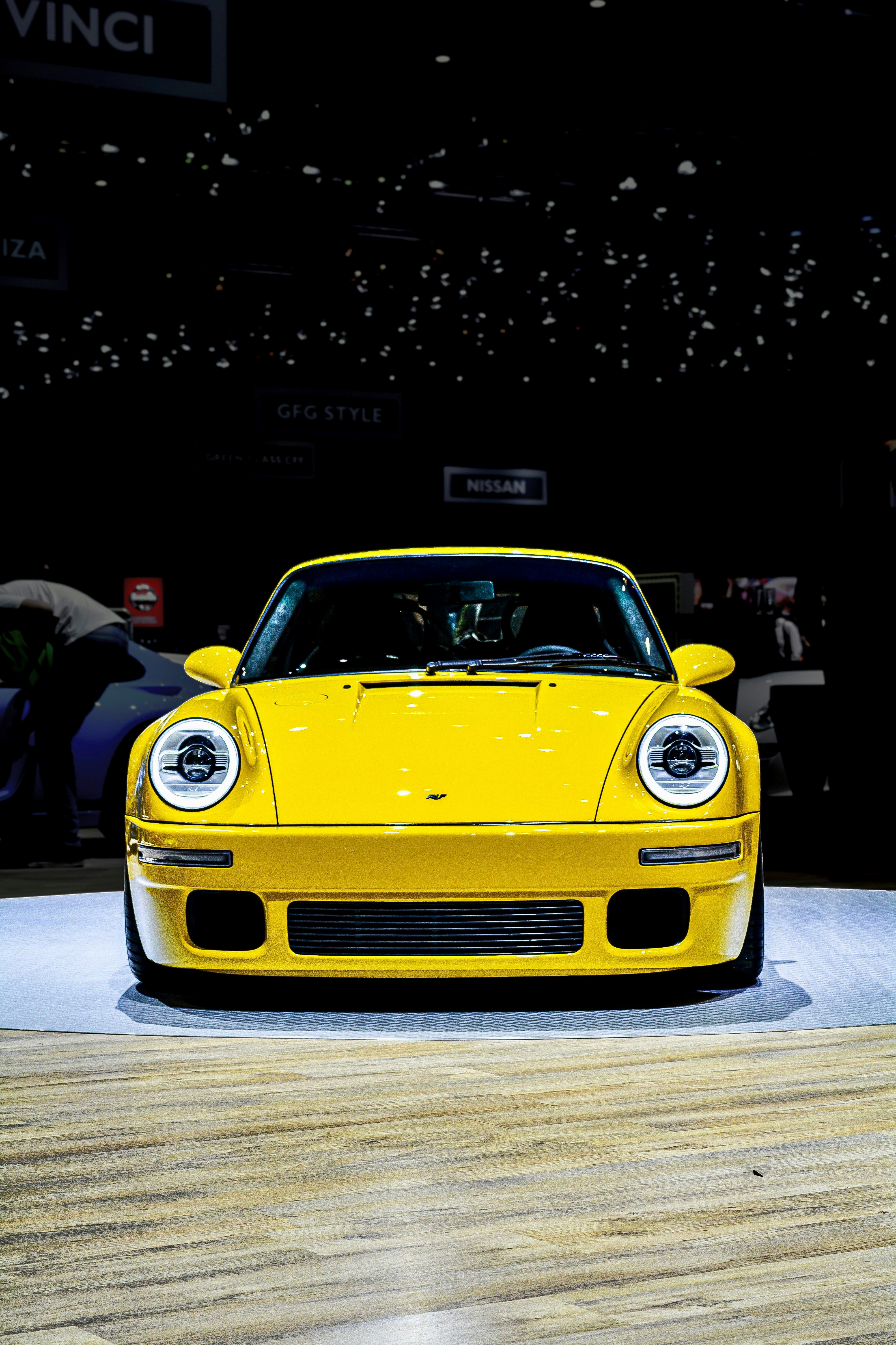 yellow porsche 911 parked on street during night time