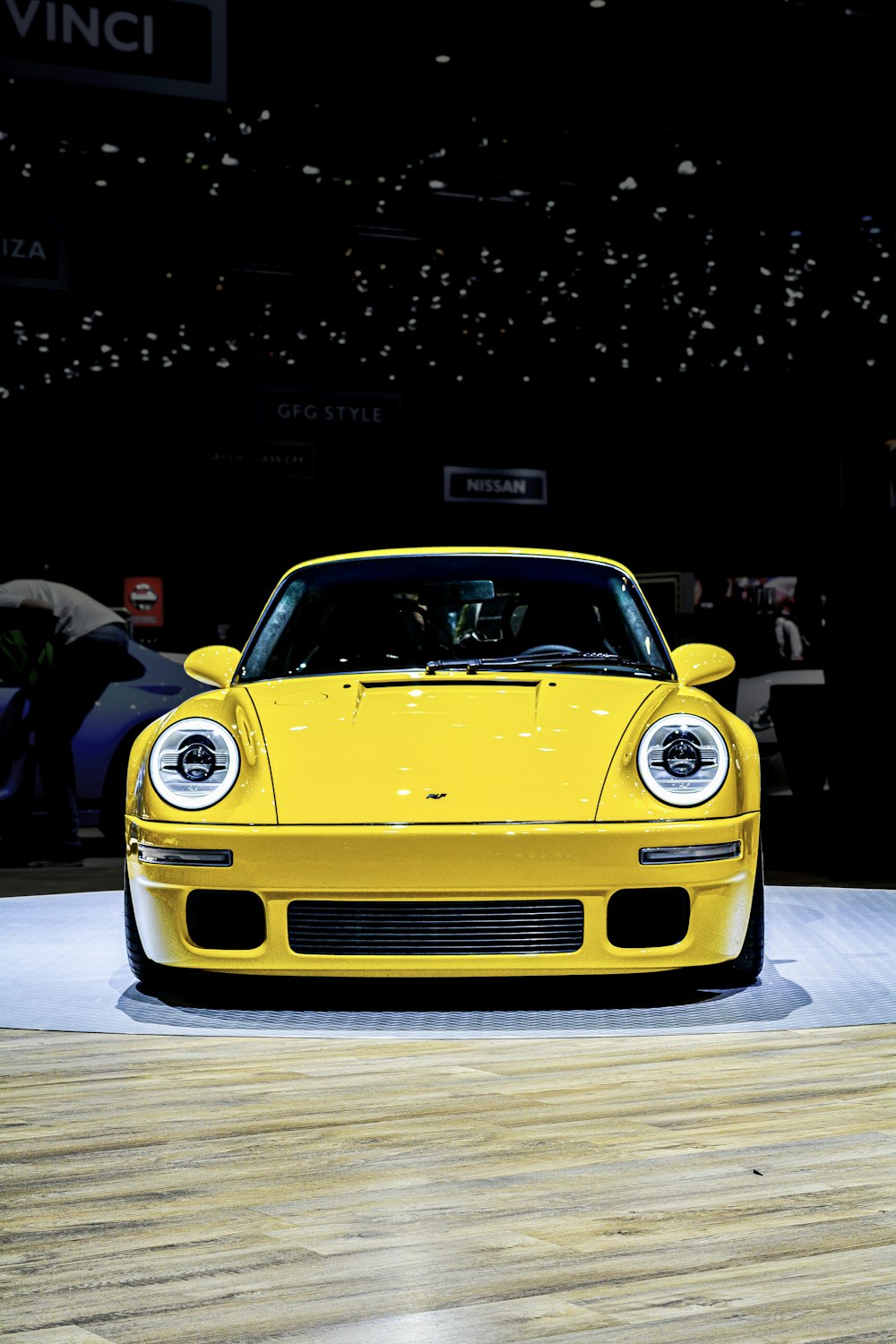 yellow porsche 911 parked on street during night time
