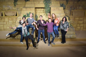 A lively group photo taken at a famous landmark included in a Viajaviva tour package