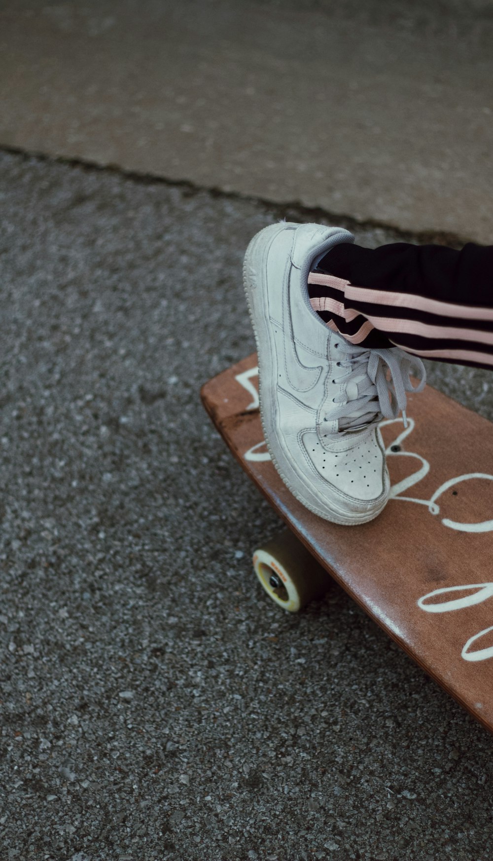 person wearing white nike air force 1 high