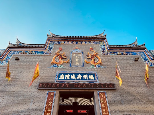 brown and white concrete building under blue sky during daytime in Fuzhou China