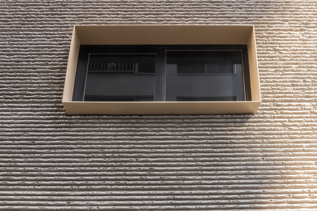 brown wooden framed glass window