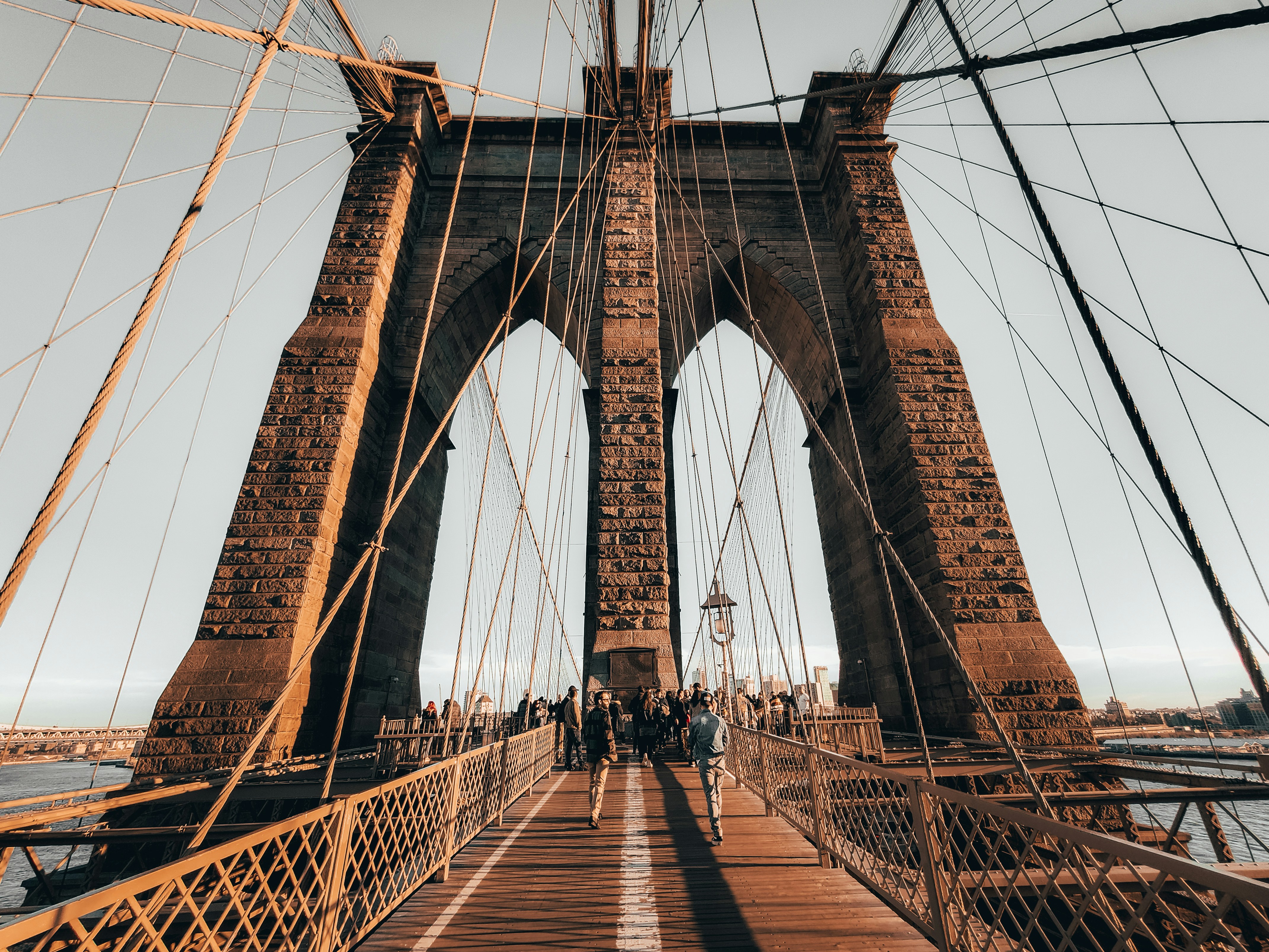 brown wooden bridge under blue sky during daytime
