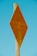 A wooden post supports a diamond-shaped, rusty orange metal sign with the words 'TELEPHONE CABLE' embossed on it. The background is a clear, bright blue sky, creating a vivid contrast with the sign.