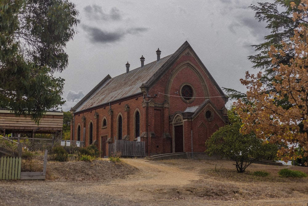 brown and gray concrete church under gray cloudy sky