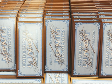 Close-up of Nutella and Milka chocolate bars arranged neatly.