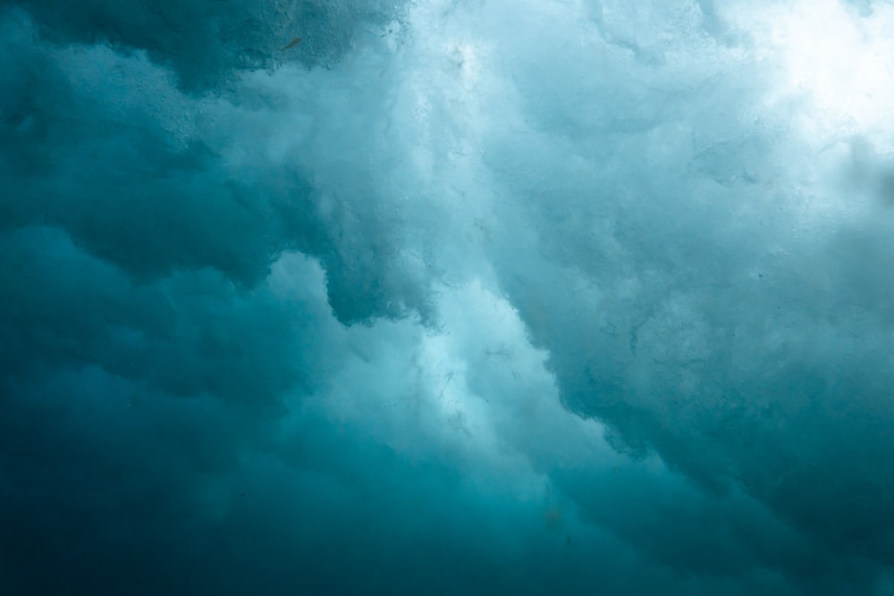 white clouds over blue sea