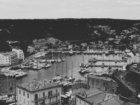 grayscale photo of city buildings in Bonifacio France