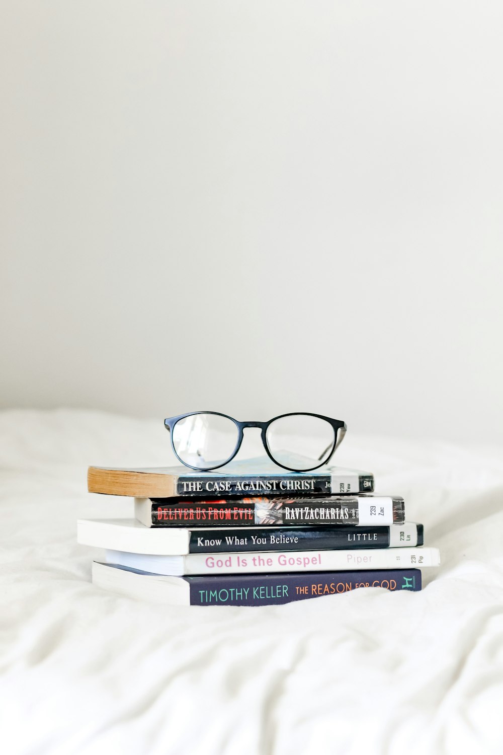 black framed eyeglasses on books