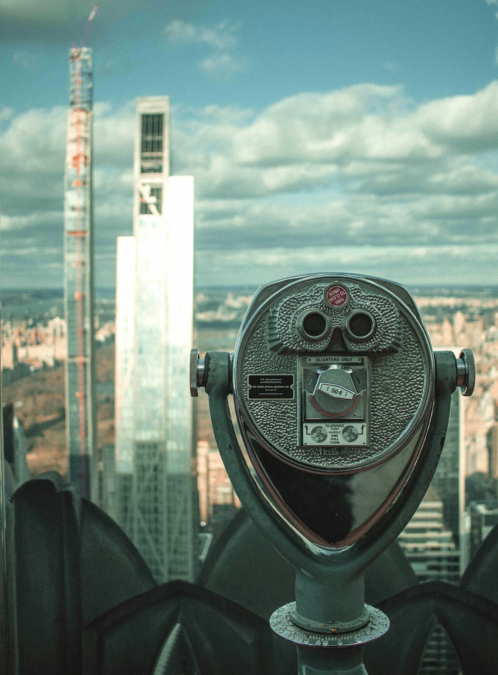 black and gray coin operated binoculars