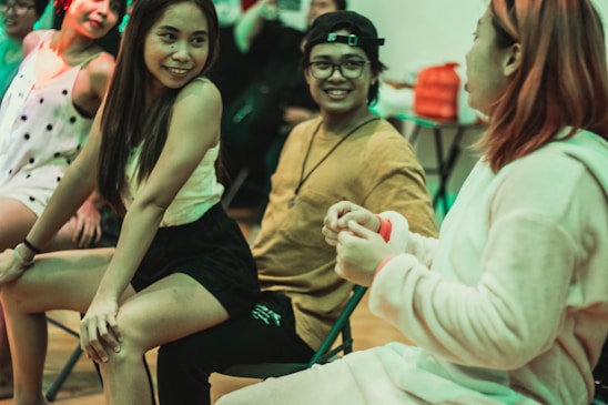 A vibrant image of people chatting happily.