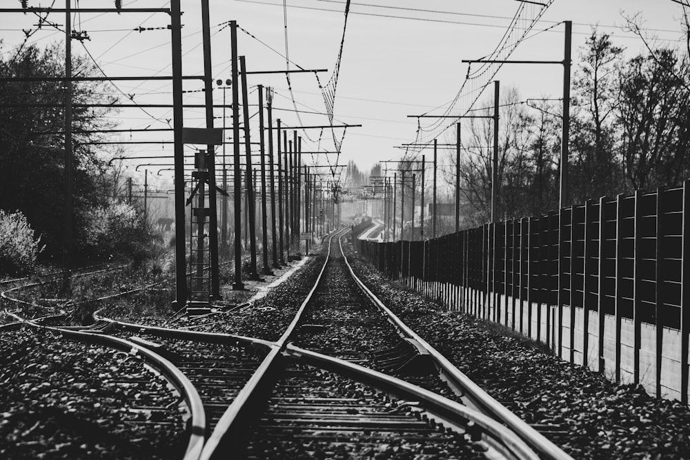 grayscale photo of train rail