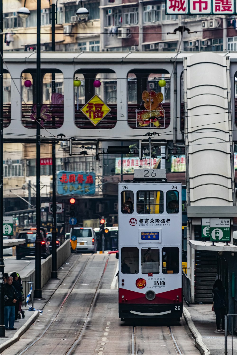 white and green bus on the street during daytime