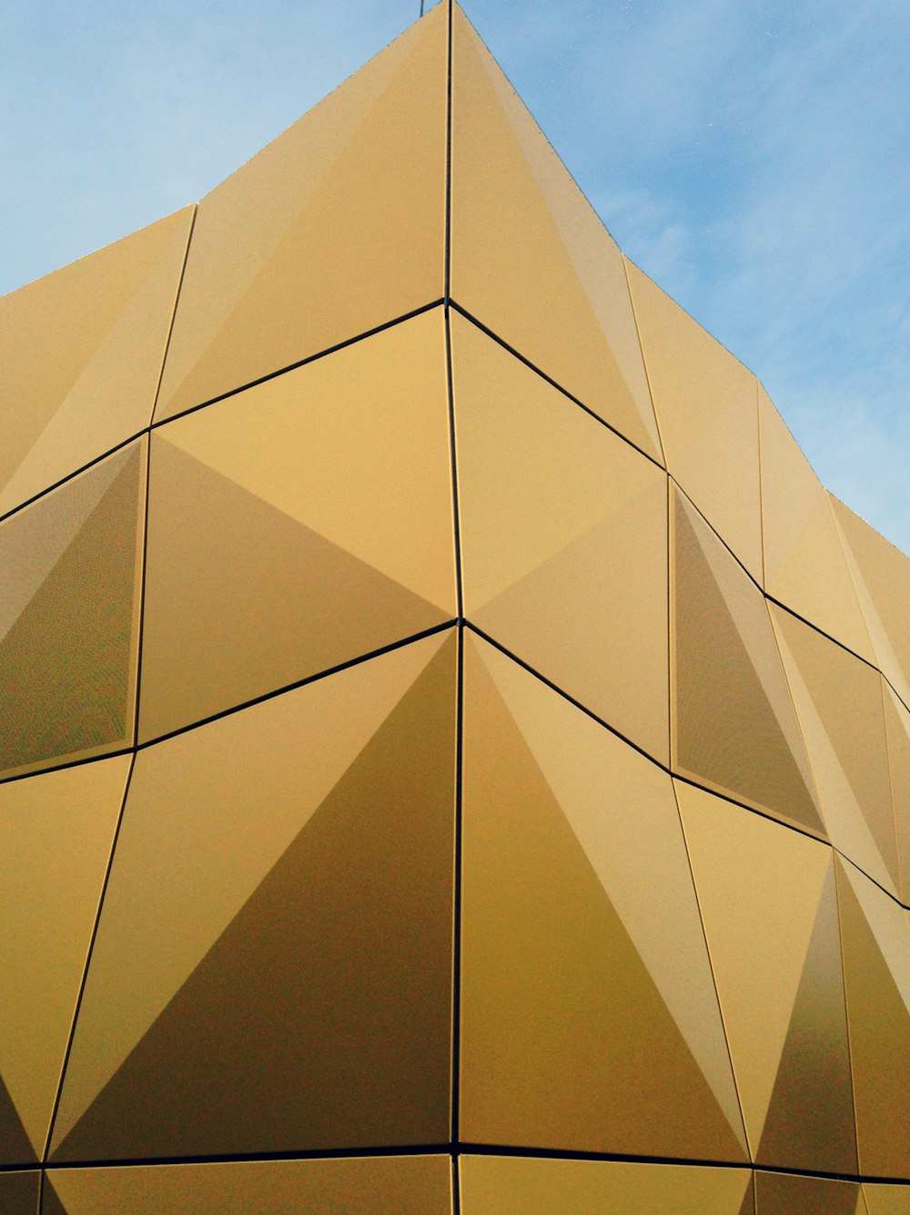 brown concrete building under blue sky during daytime