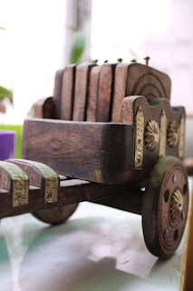 Close-up of the sturdy iron frame and natural wood details of the wine cart.