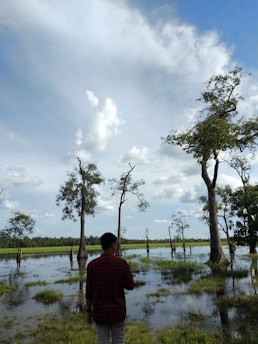 A peaceful scene of a person reflecting outdoors, embodying clarity and calm.