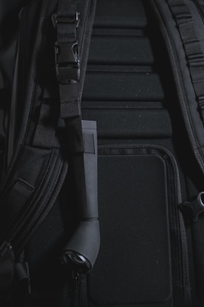Close-up of the breathable back panel and padded shoulder straps of the backpack.