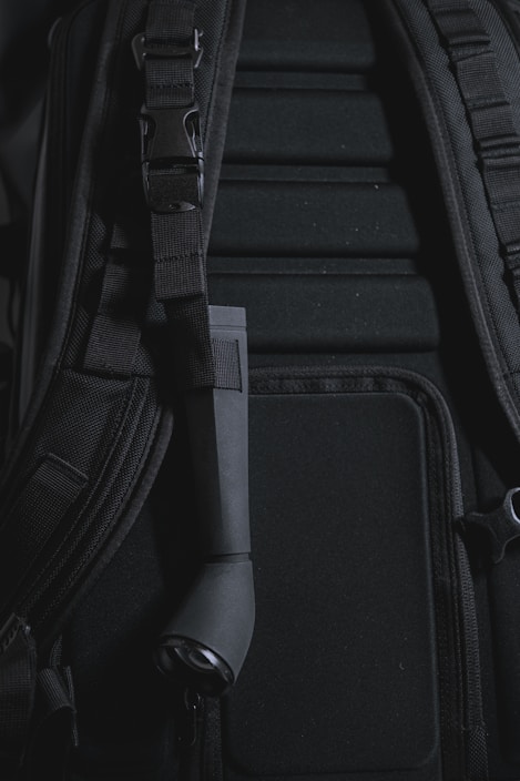 A close-up of a modern backpack with various compartments and features.