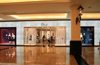 people walking on hallway with glass doors