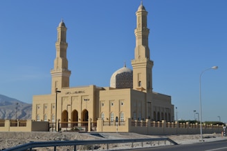 beige concrete building under blue sky during daytime