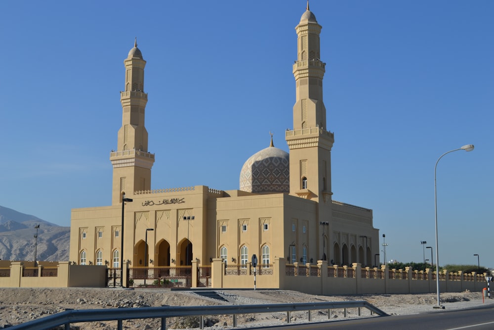 beige concrete building under blue sky during daytime