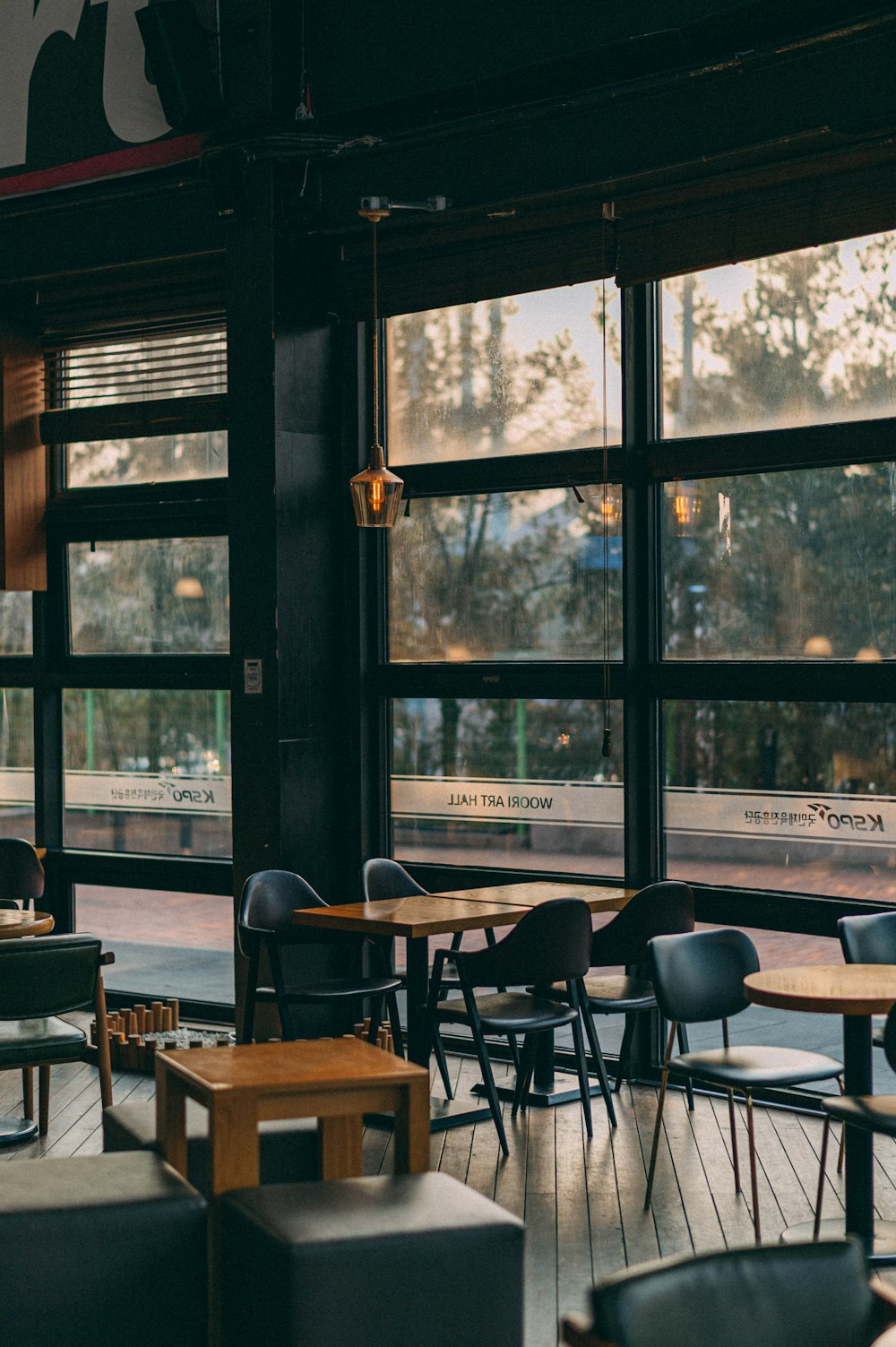 black and brown chairs and table near window