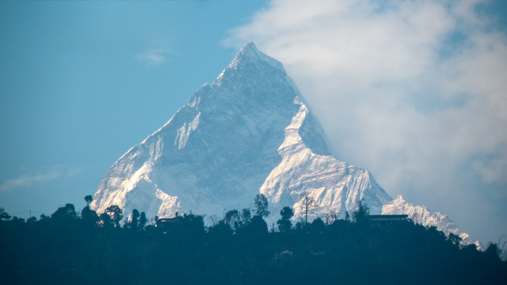 snow covered mountain during daytime