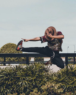 A vibrant illustration showing a person joyfully exercising outdoors, surrounded by symbols of growth like blooming flowers and a rising sun, embodying sustainable fitness habits.